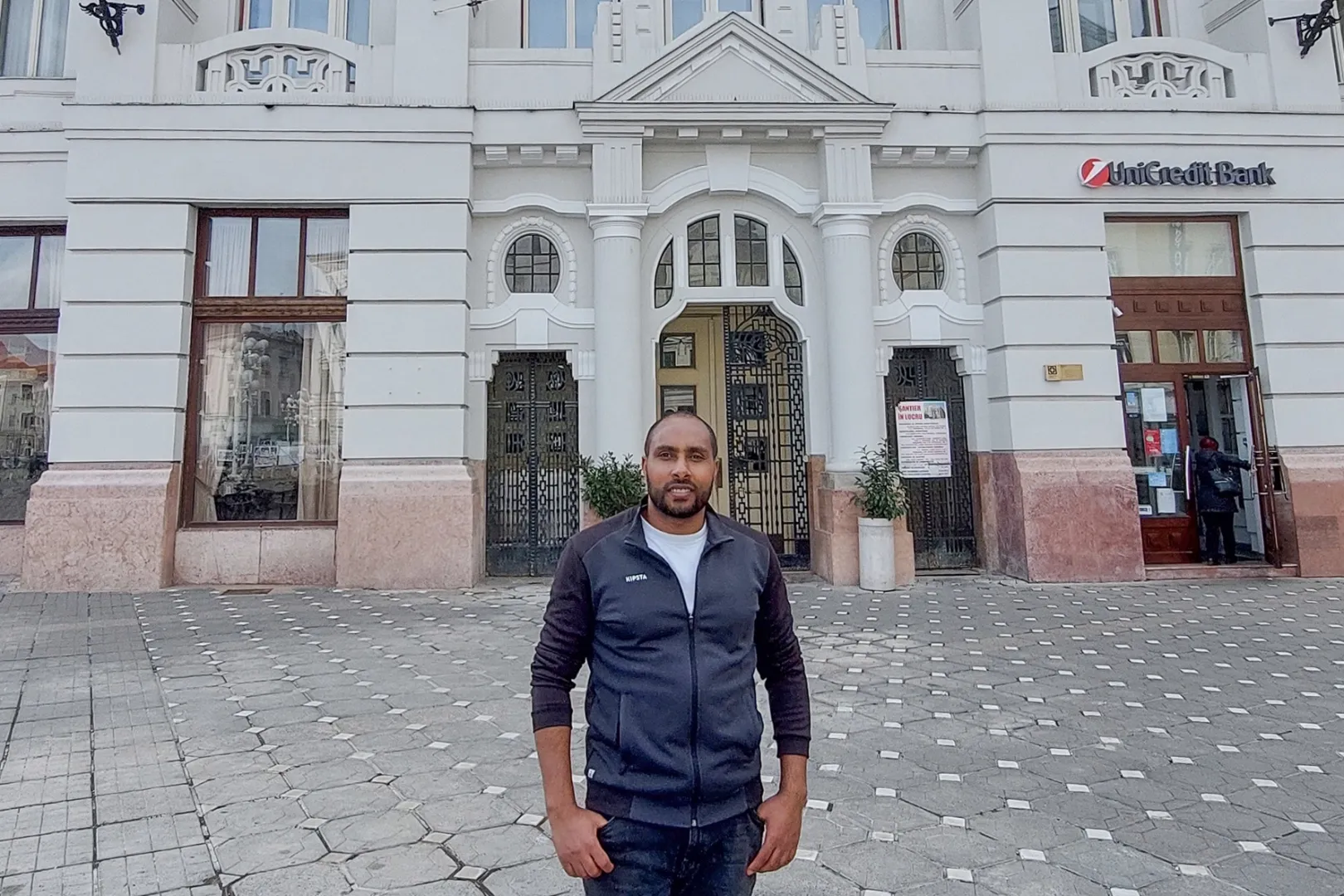 Ayele Chala, a PhD student at Széchenyi István University, in front of a building at the Politehnica University Timișoara